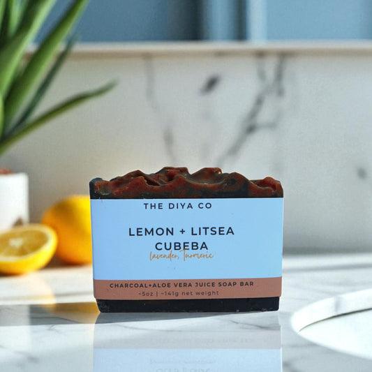 Bar of soap with packaging labeled 'The Diya Co Lemon + Litsea Cubeba' on a kitchen counter.