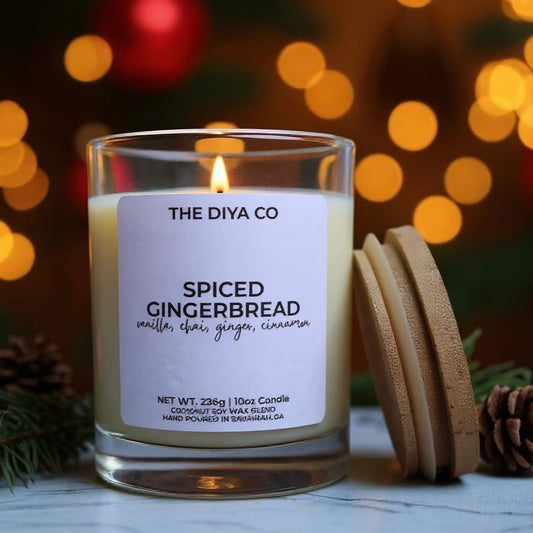 Candle labeled 'The Diya Co Spiced Gingerbread' with decorative background